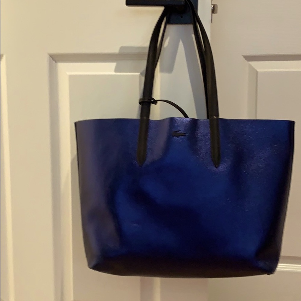 Lacoste reversible chrome blue and black purse